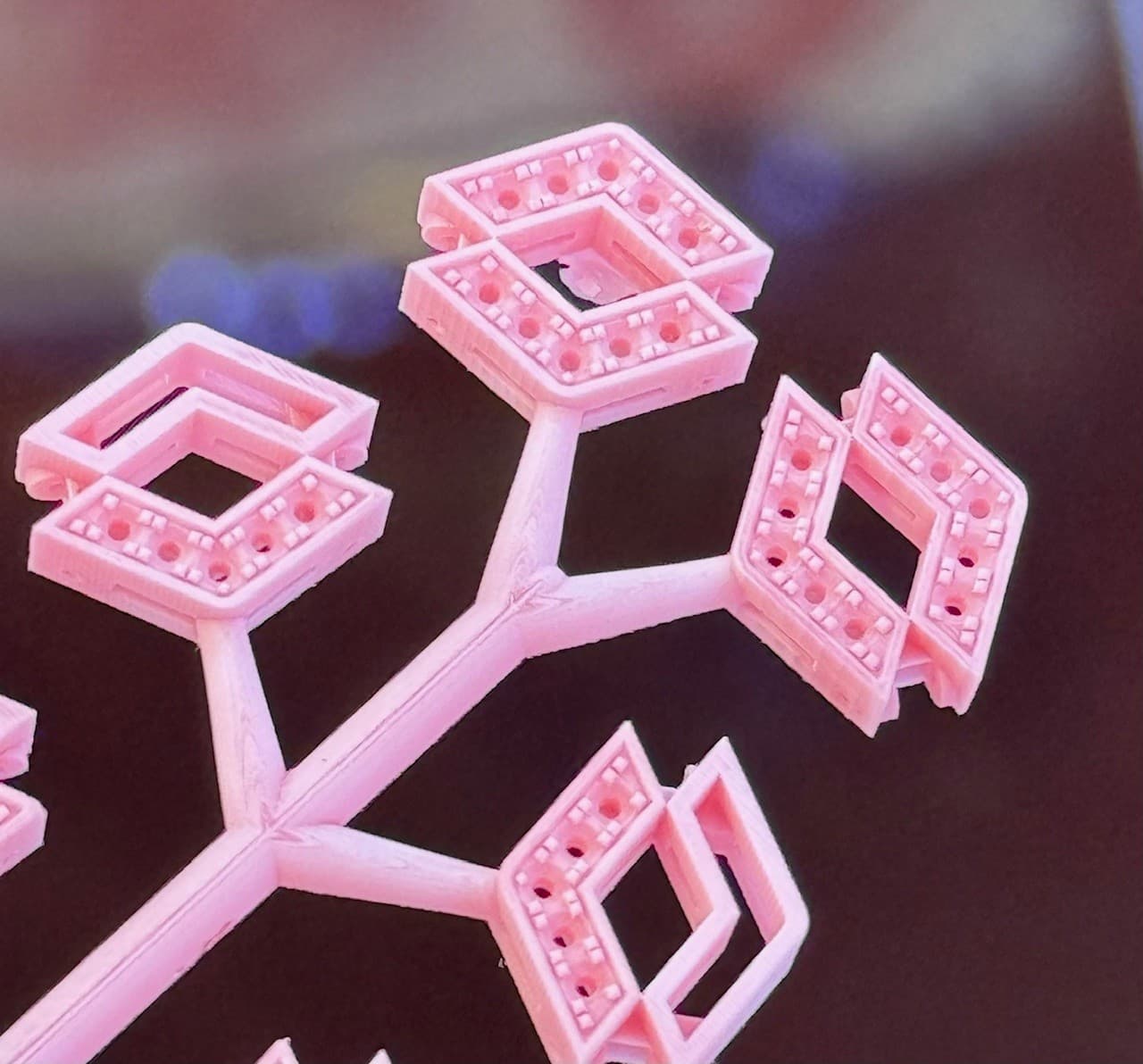 Close-up of castable wax jewellery settings after CAM printing